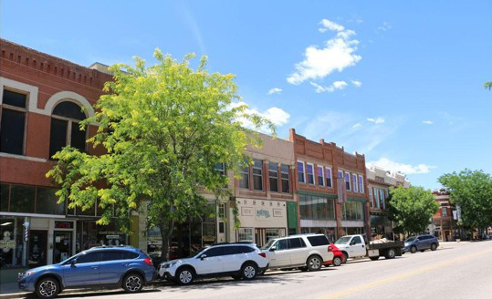 Historic Main Street Florence, Colorado with cars parked on street